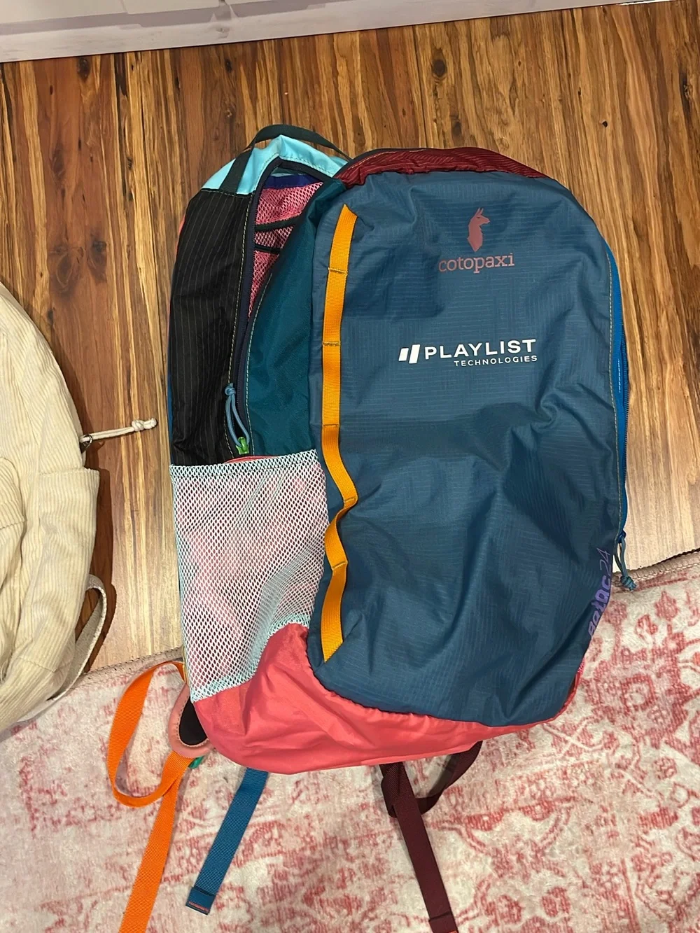 Cotopaxi Teal & Coral Backpack with Playlist Technologies Logo